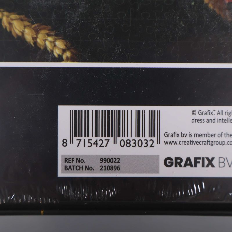 Närbild på barcode och Grafix-varumärke på pusselboxen