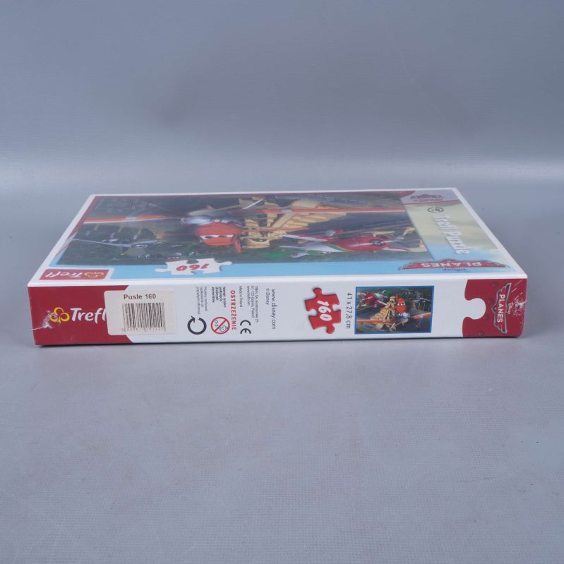 Pusslets långsida med bitantal och ålderssymbol