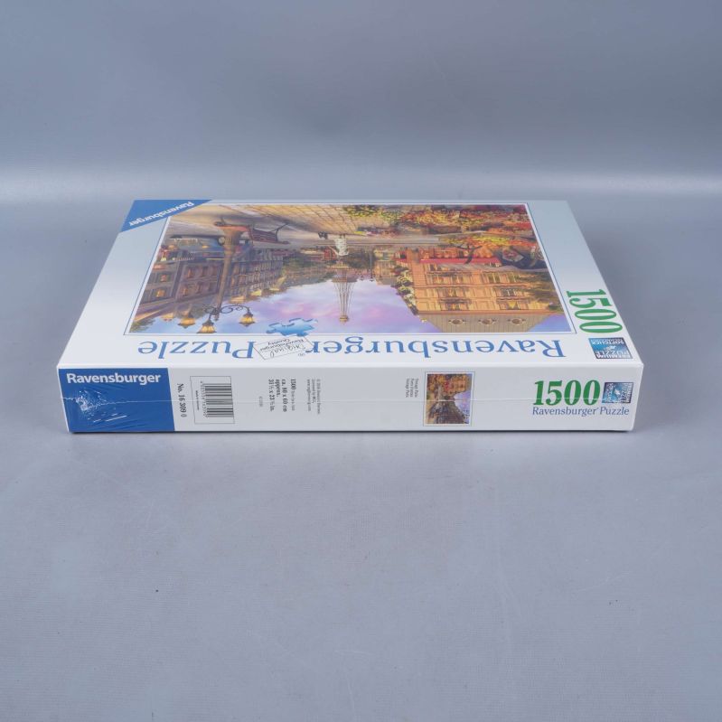 Sida av pusselbox som visar Ravensburger logotyp och information