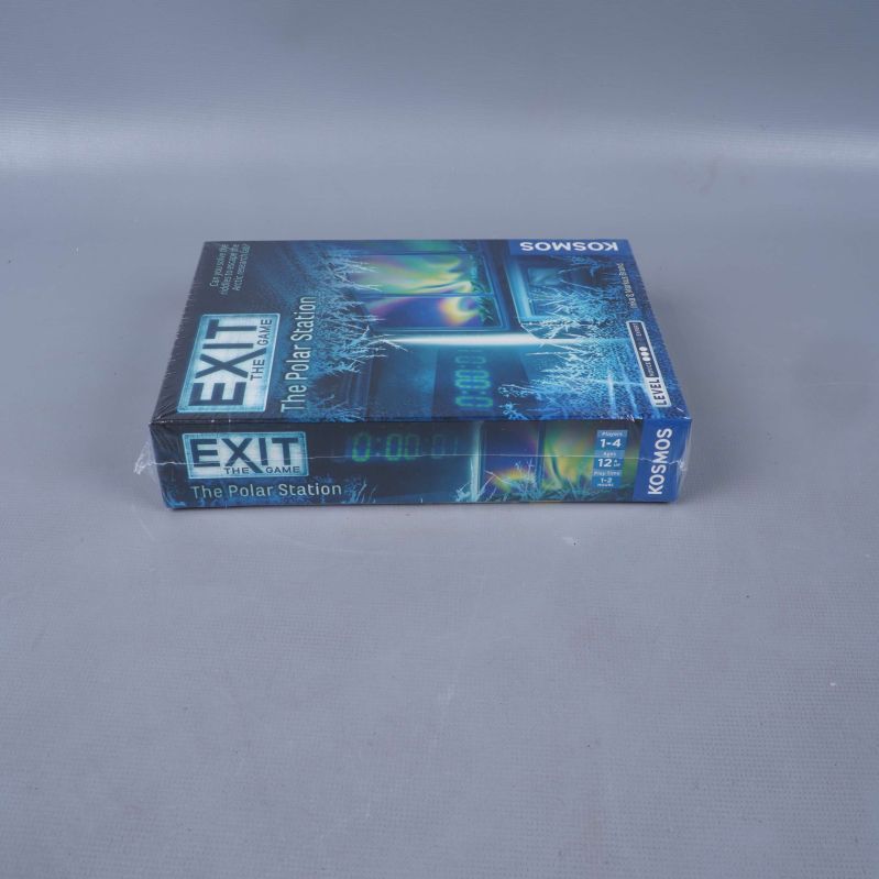 Exit The Game The Polar Station liggande på sidan på grått underlag