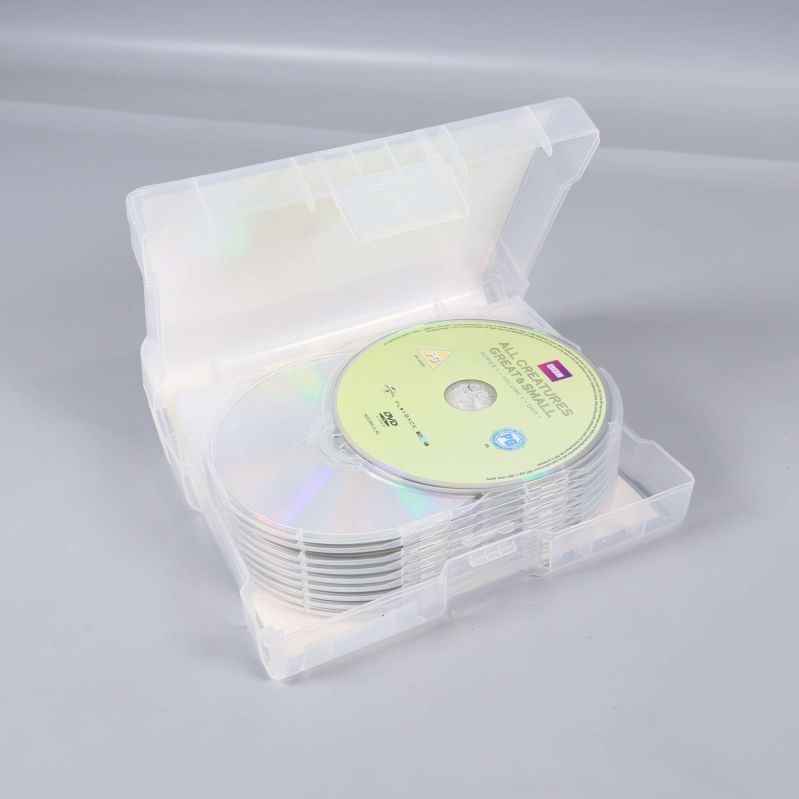 DVD-box i plast öppnad med staplade skivor synliga