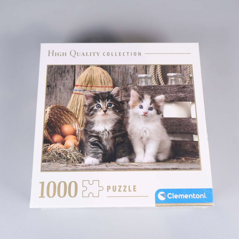 Framsida av pusselask med två kattungar och 1000 bitar