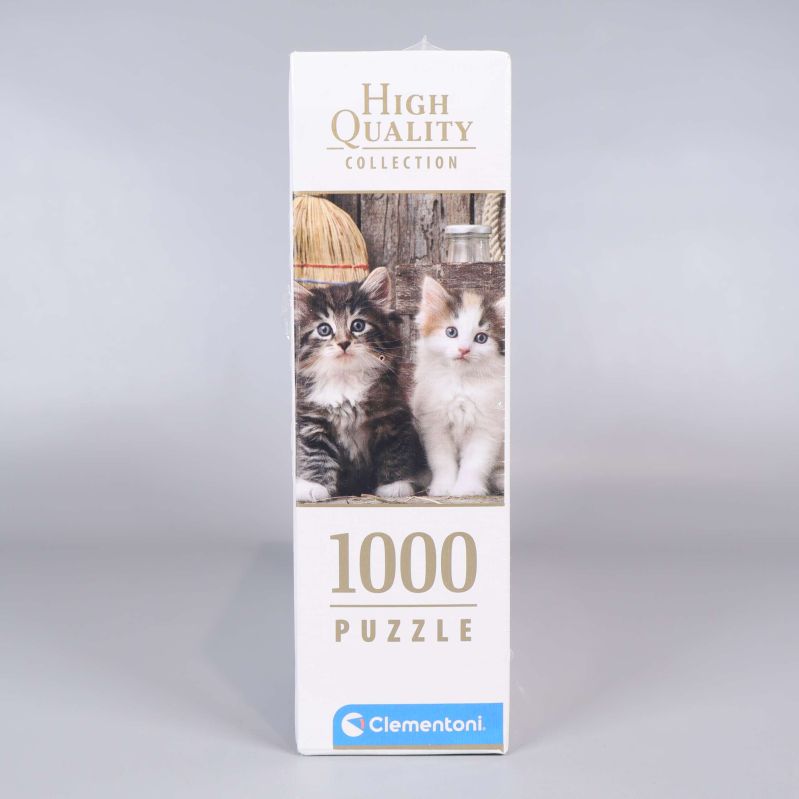 Sida av pusselask med kattungar och antal bitar