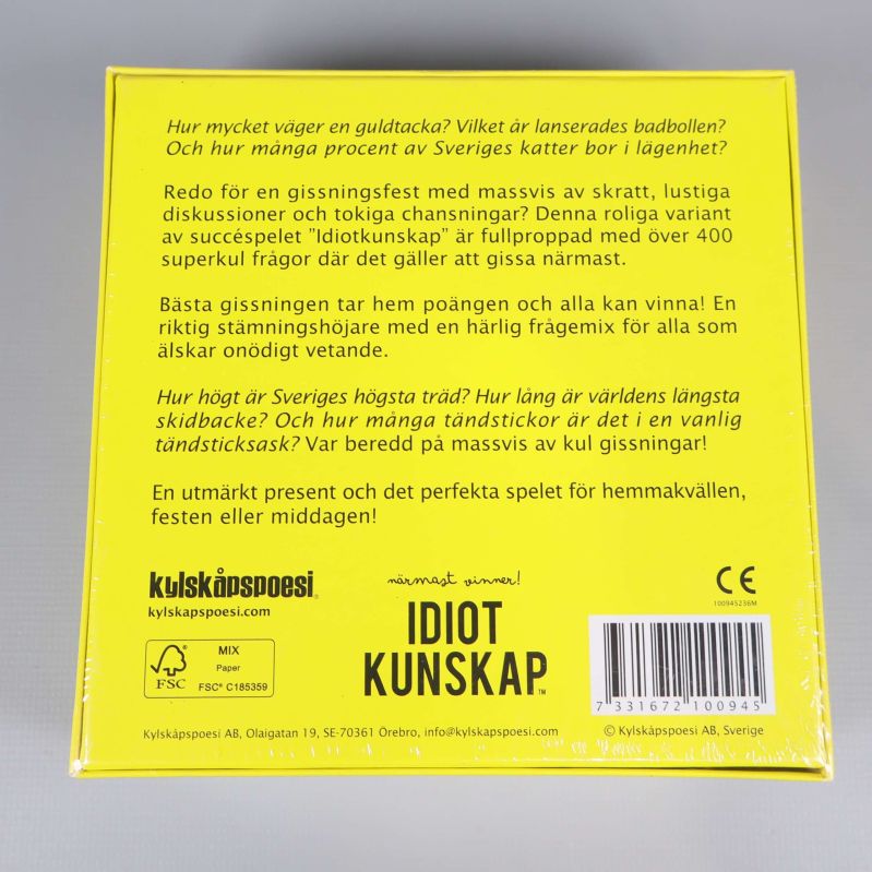 Baksida av gul spelbox med spelbeskrivning och text