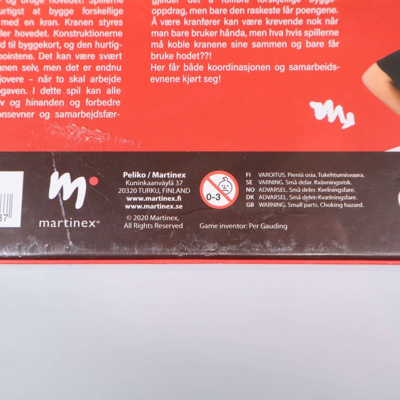 Närbild av baksidan på Bild'it 2.0 med tillverkare och varningstext