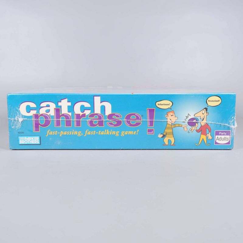 Sida av Catch Phrase-kartong med spelnamn och illustrationer