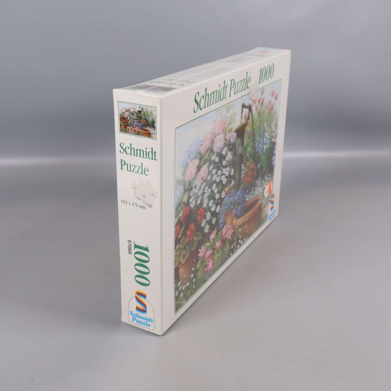 Schmidt Puzzle ask sedd från hörn med tydlig pusselbild