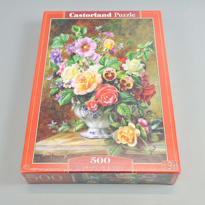 Pusselbox med färgglad blomvas och röd ram