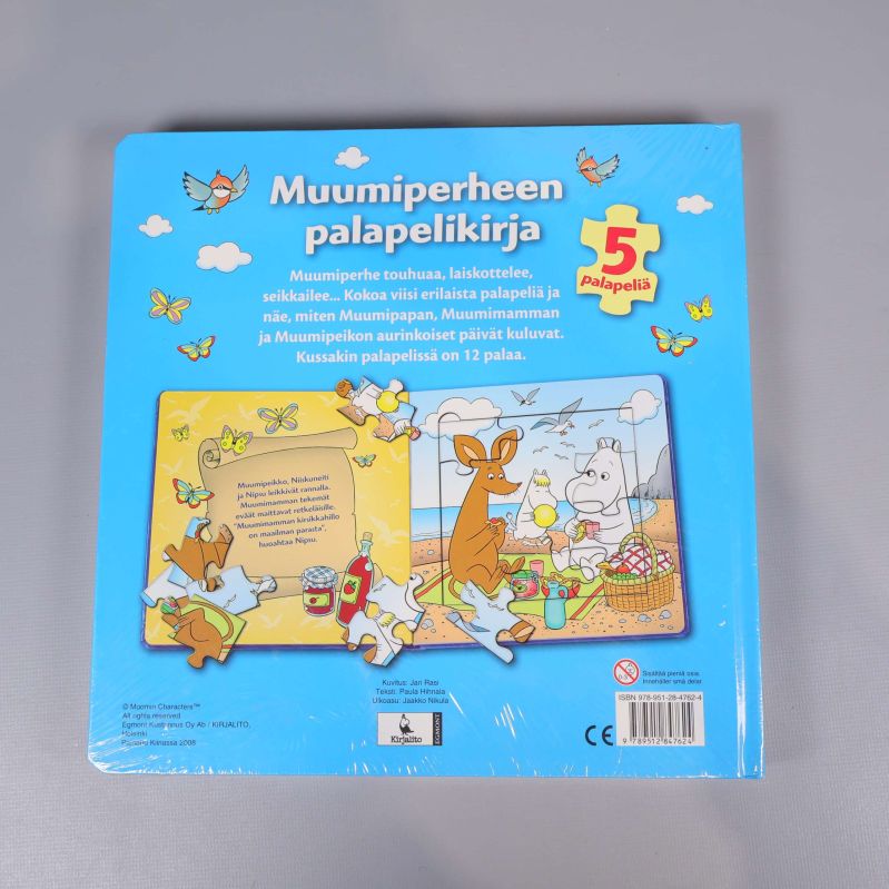Baksidan av Muumiperheen pusselbok med illustrationer