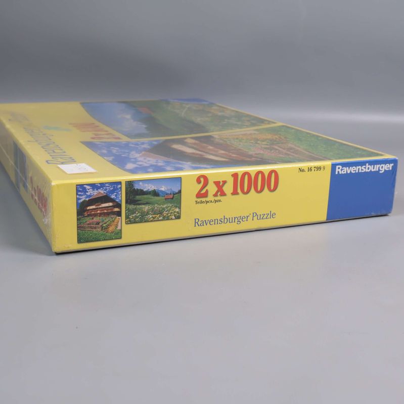Närbild av sidan på Ravensburger pusselbox, 2 x 1000 bitar