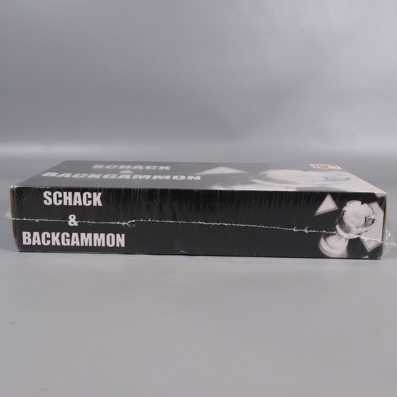 Sida av box med schack och backgammon text