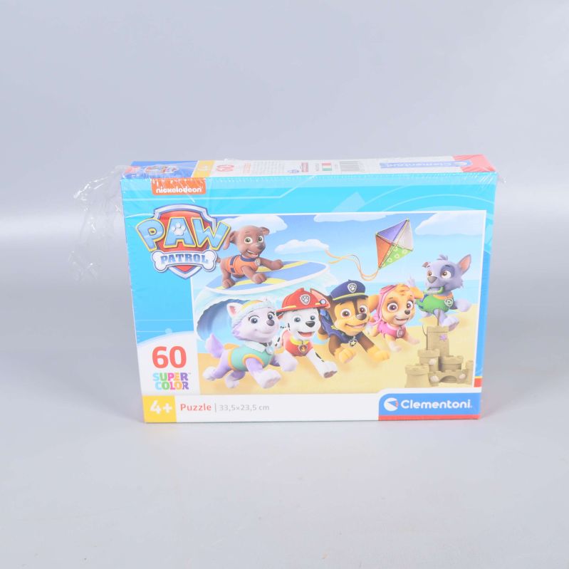 Framsidan av Paw Patrol pussel med valpar och drake