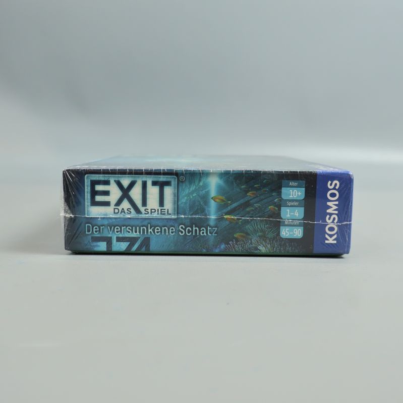 Sidan av spelasken Exit Das Spiel med logotyp och information