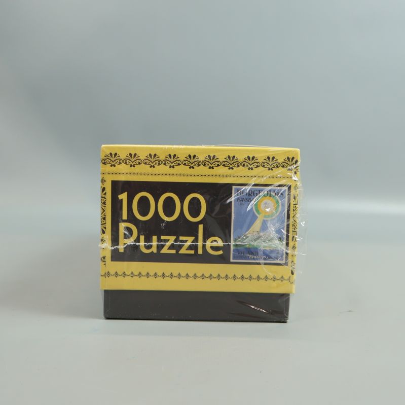 Pusslets kortsida med texten 1000 Puzzle och motiv