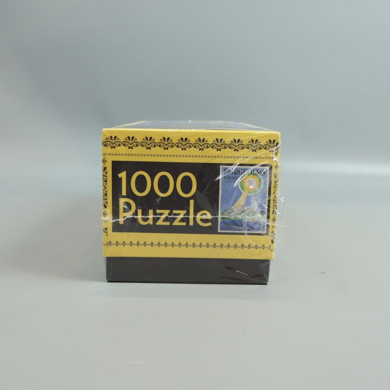 Pusslets andra kortsida med 1000 Puzzle och motiv