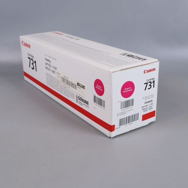 Canon 731 tonerpatron låda sedd från vinkel med magentamarkering