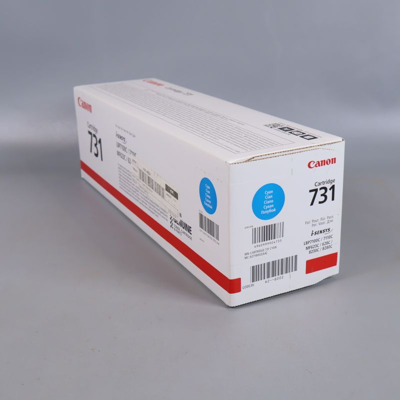 Sned vy av Canon 731 cyan tonerförpackning med färgmarkering