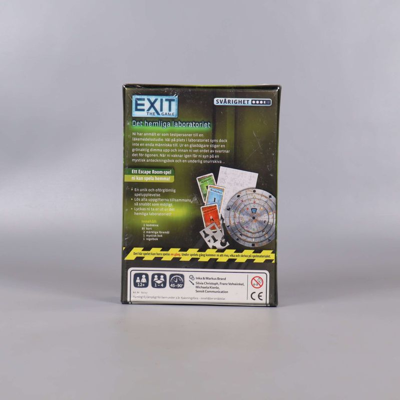 Baksida av Exit the Game Det hemliga laboratoriet visar spelkomponenter och instruktioner