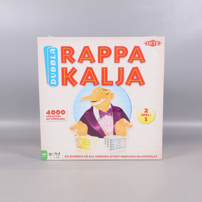 Framsidan av Dubbla Rappakalja med tecknad karaktär och färgglad text