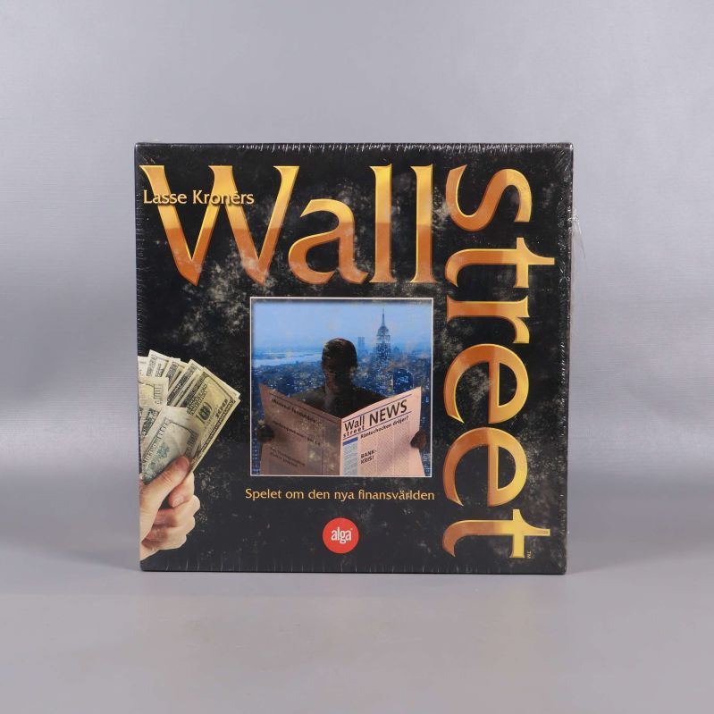 Framsidan på Wallstreet sällskapsspel med stor guldfärgad logotyp