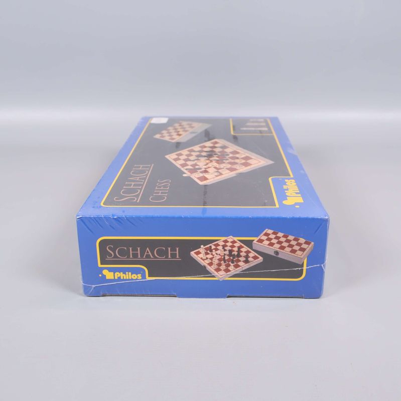 Schackspel i ask, vy från sidan med texten Schach