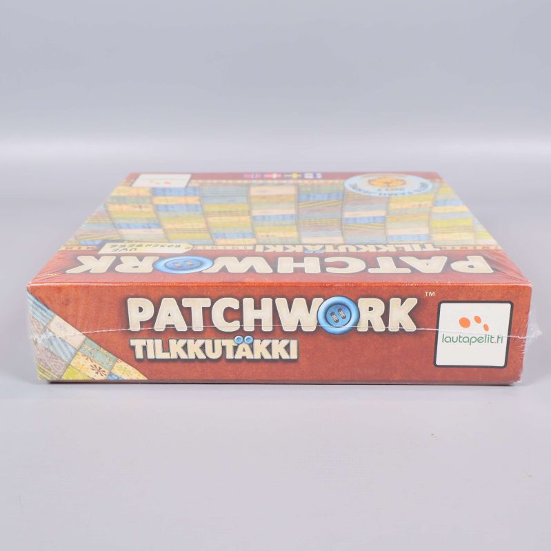 Patchwork spelask sedd från sidan med logotyp