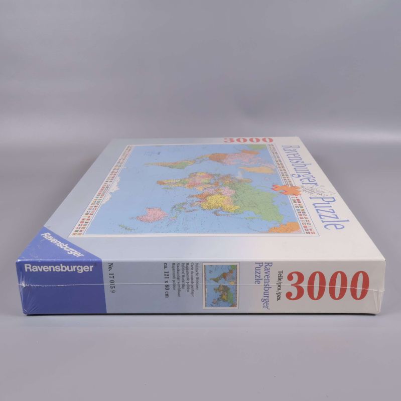 Ravensburger pussellåda, sidan med text och motiv