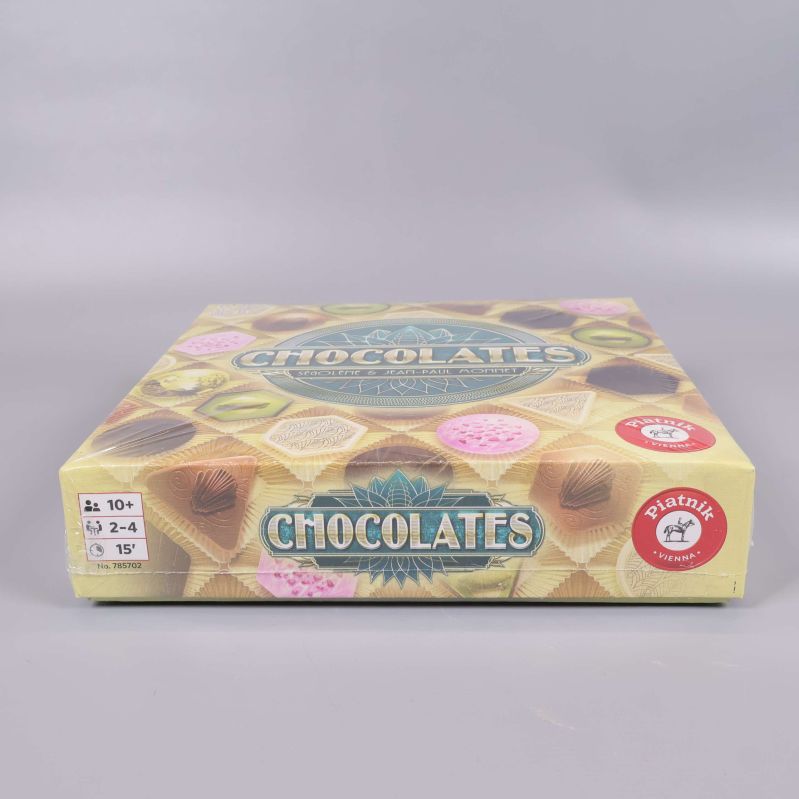 Sidan av spelasken Chocolates med åldersrekommendation