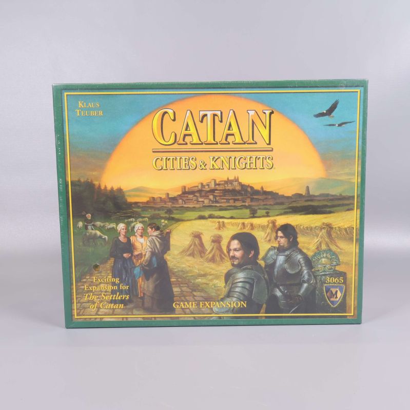 Framsidan av Catan Cities & Knights expansionspaket med illustration av riddare
