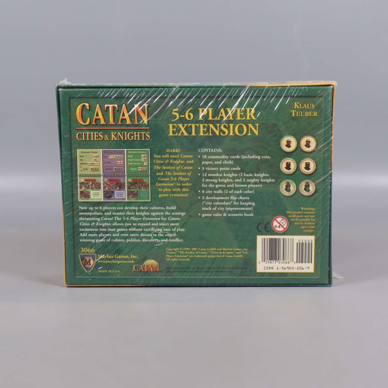 Baksidan av Catan Cities & Knights expansion visar innehåll och regler