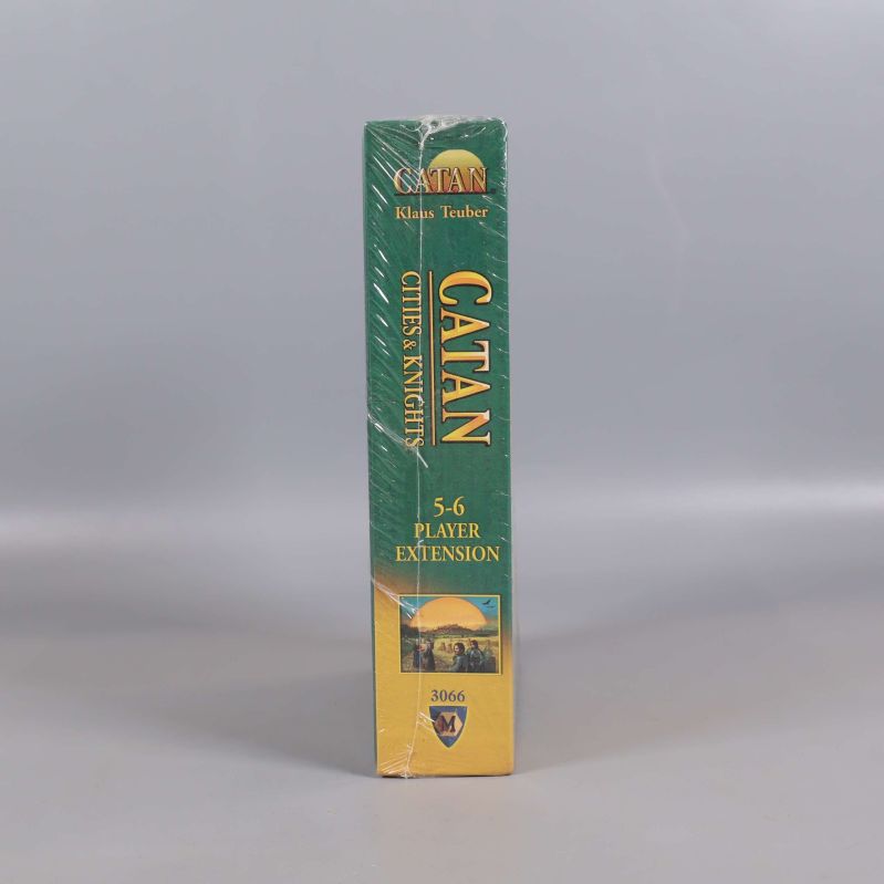 Sidan av Catan Cities & Knights expansion med titeln och illustration