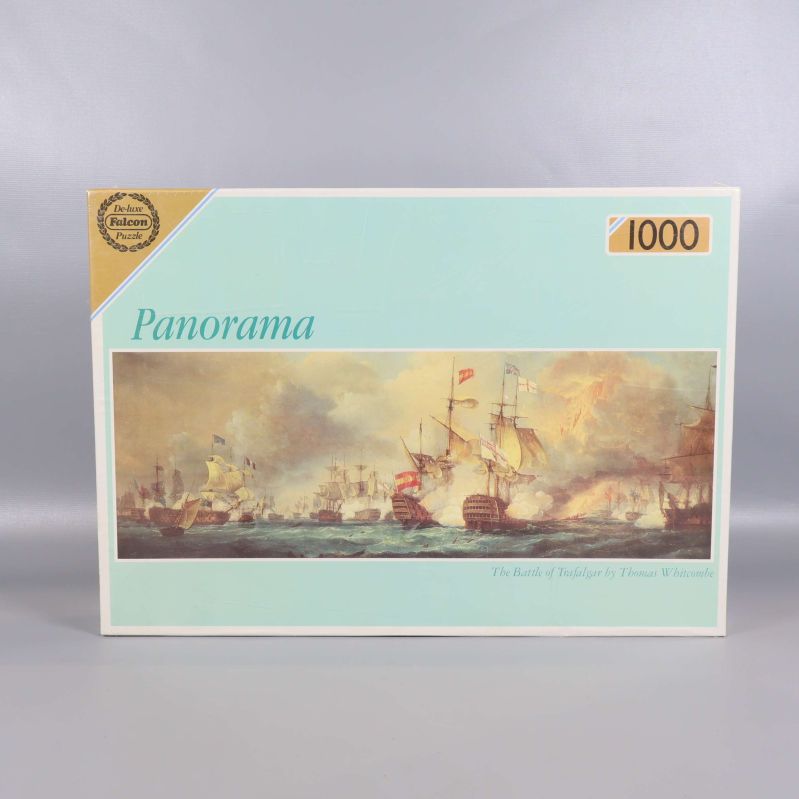 Pusslets framsida och motiv med stora segelfartyg i batalj