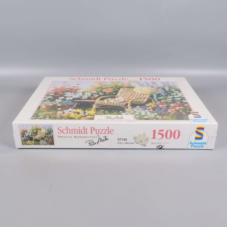 Framsida av pussellåda med Schmidt Puzzle logotyp och 1500 bitar