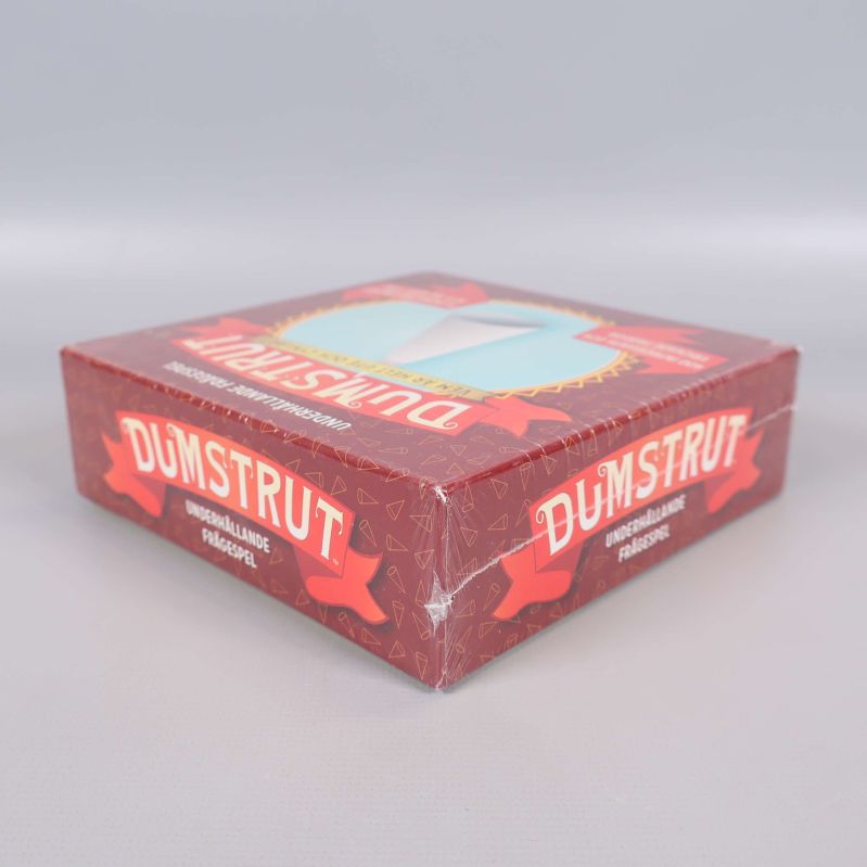Dumstrut spel ask från sidan, visar boxens tjocklek