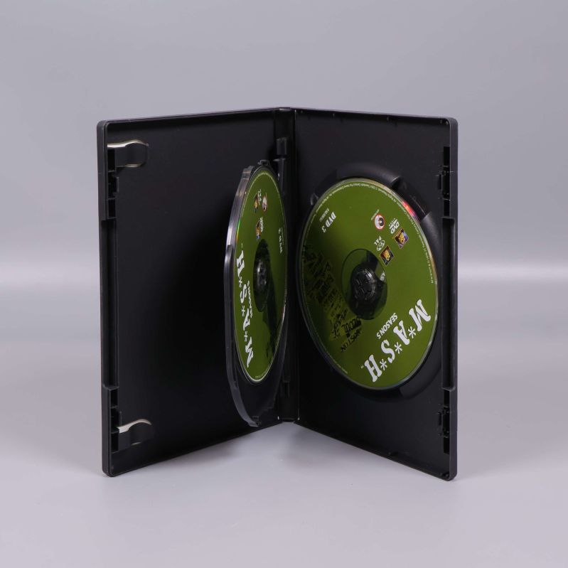 DVD-box öppen med två gröna skivor synliga