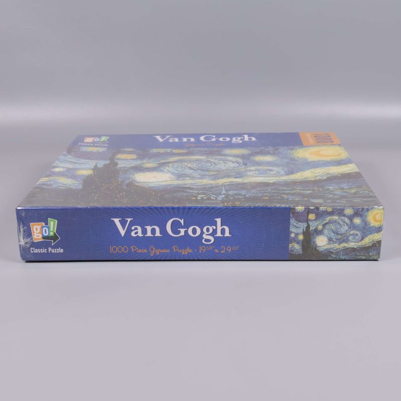 Sida av pussellåda med Van Gogh motiv och logga