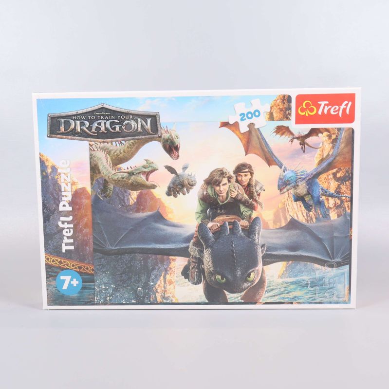 Dragons-pussel med förpackning synlig framifrån
