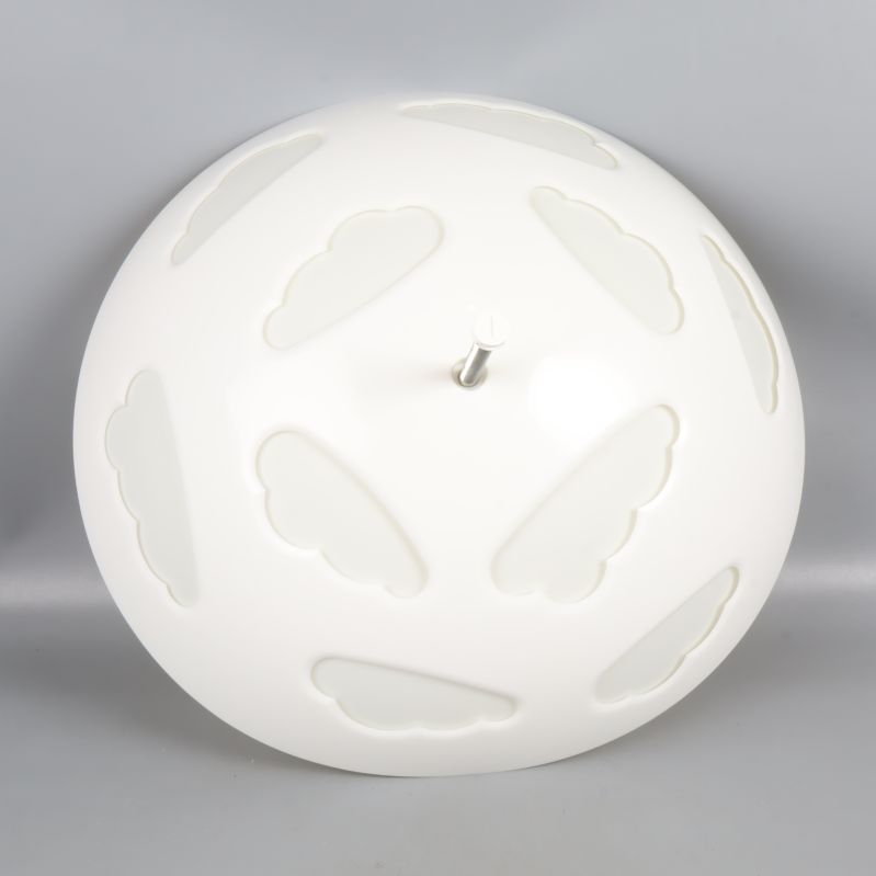 Lampa sedd ovanifrån med molnmönster