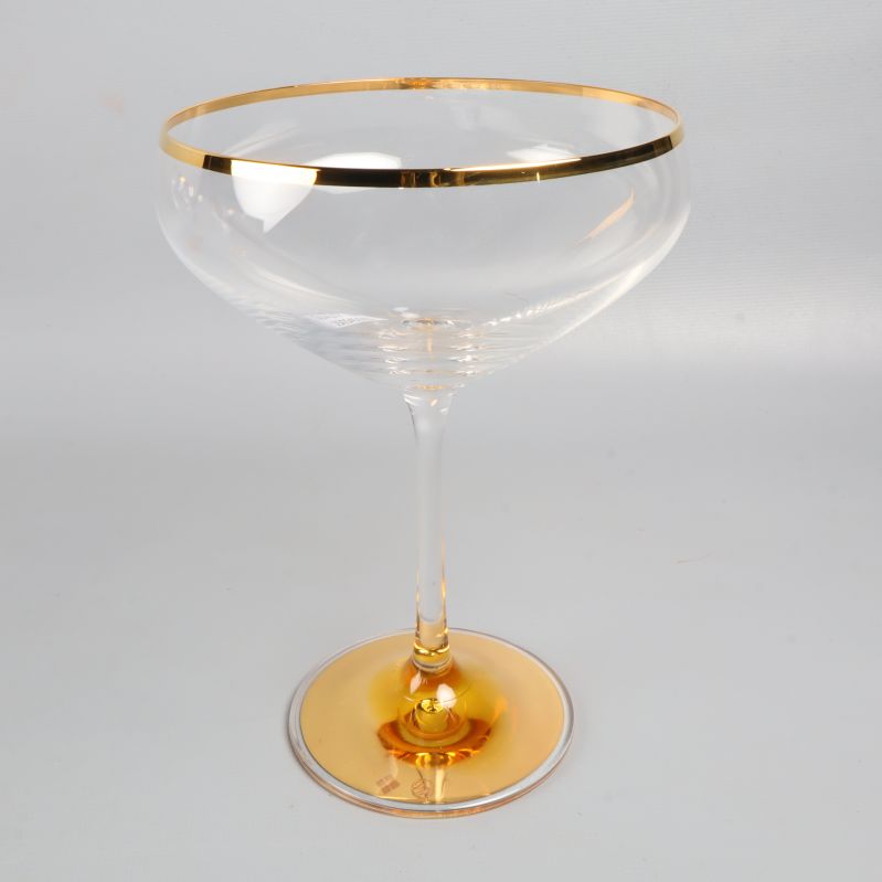 Enskilt champagneglas med guldkant
