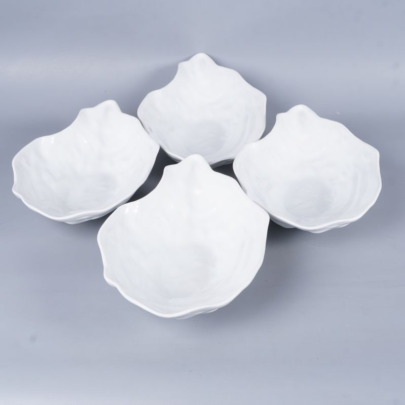 Fyra ostronskålar fotograferade uppifrån