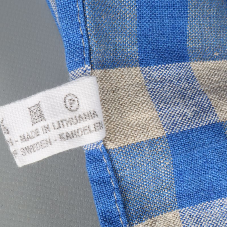 Etikett visar tillverkningsland och ytterligare information om duken