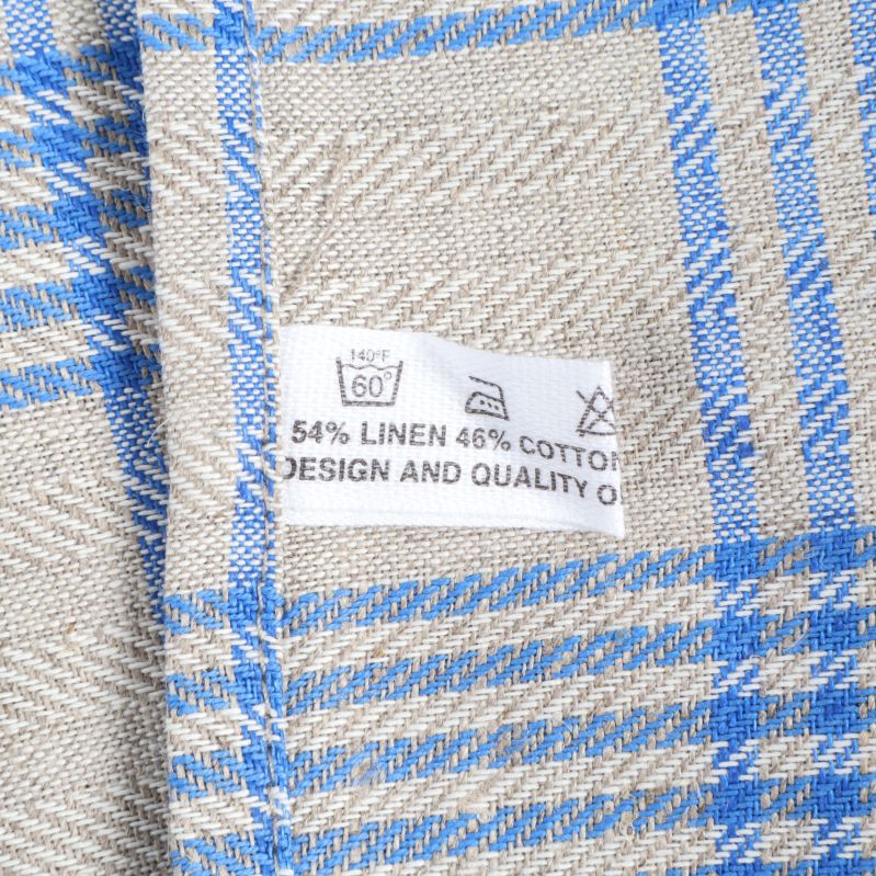 Tvättrådsetikett visar material i linne och bomull