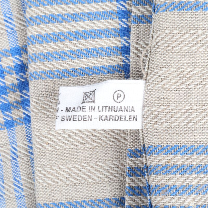 Etikett med information om ursprung och tillverkare