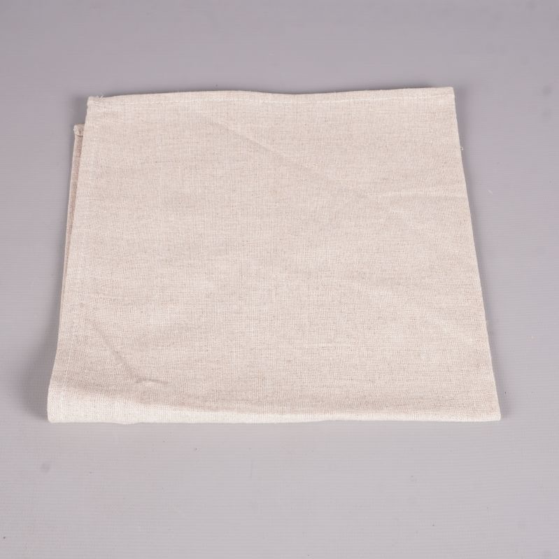 En utvikt beige tygservett med synlig struktur