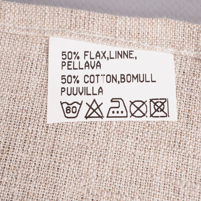 Närbild på materiallapp med linne och bomull