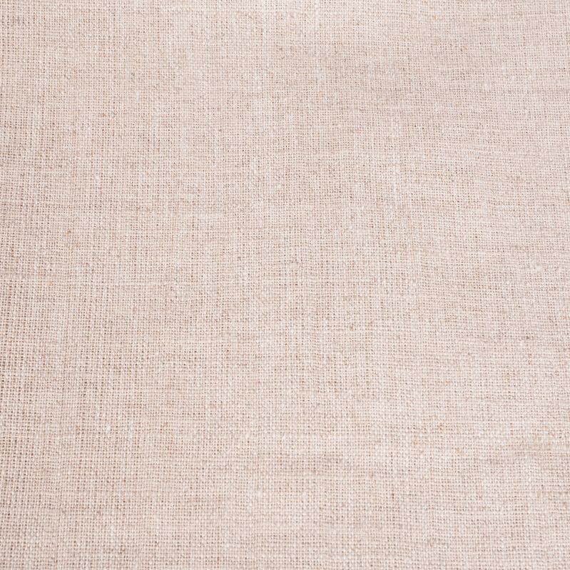 Närbild på beige tygservetts textilstruktur