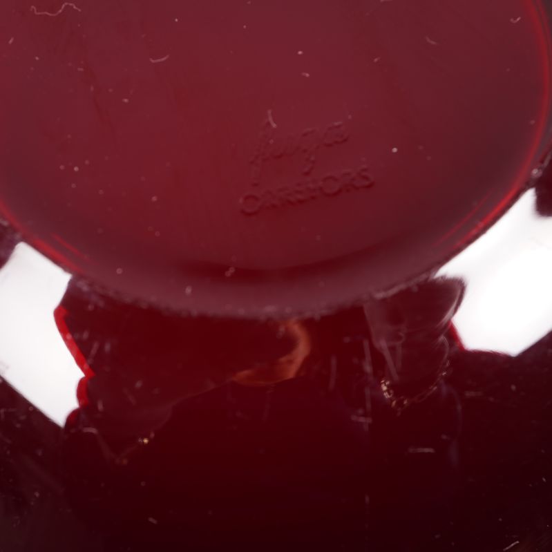 Signatur och märkning under röd Orrefors-skål