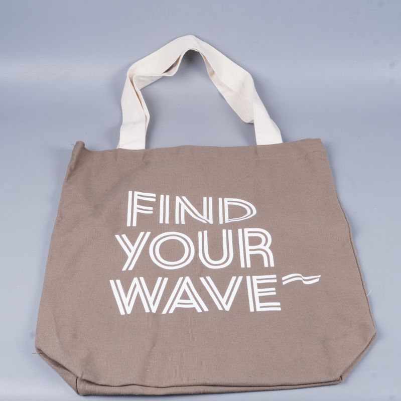 Tygkasse liggande platt med synligt tryck och handtag