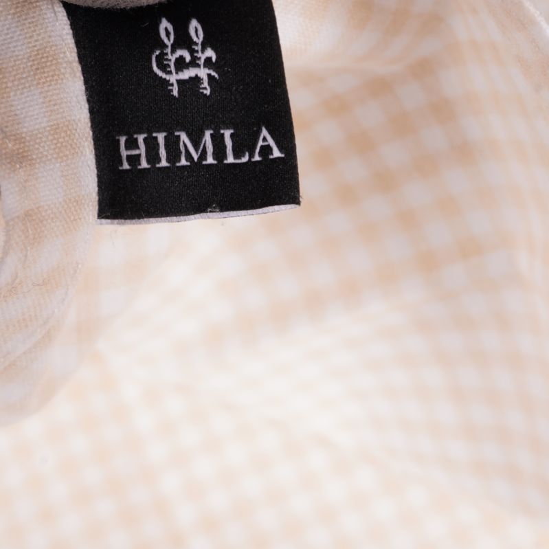 Svart himla-etikett på rutigt tyg