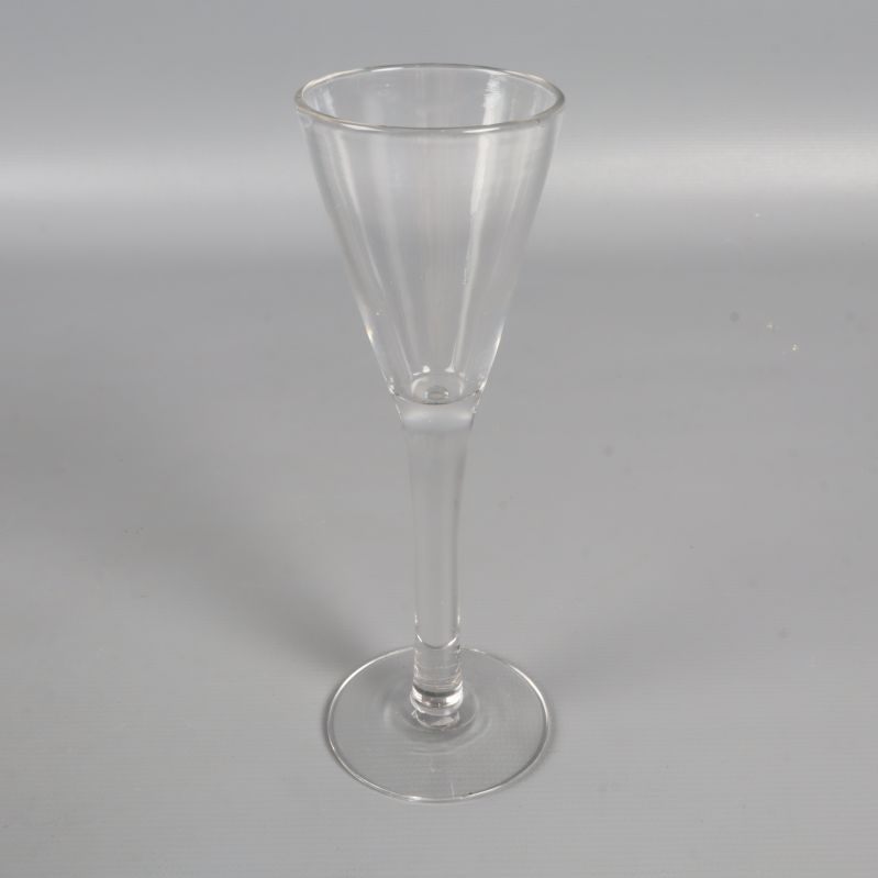 Ett separat snapsglas 